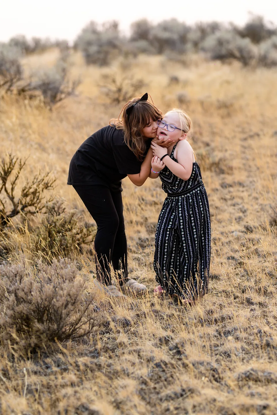 Two family members sharing an embrace outdoors